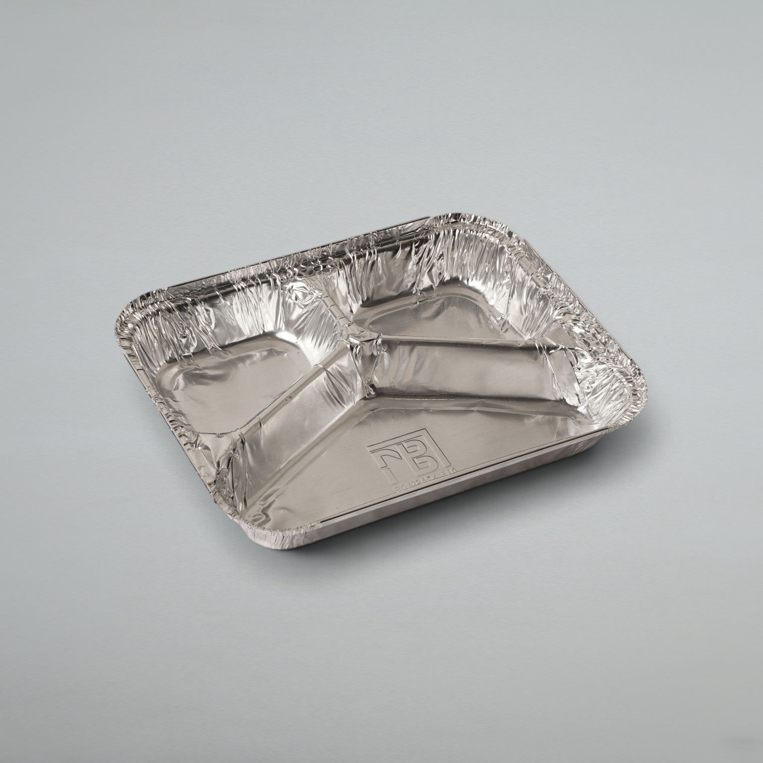 A rectangular aluminum foil compartment tray with three sections, shown on a neutral light gray background.