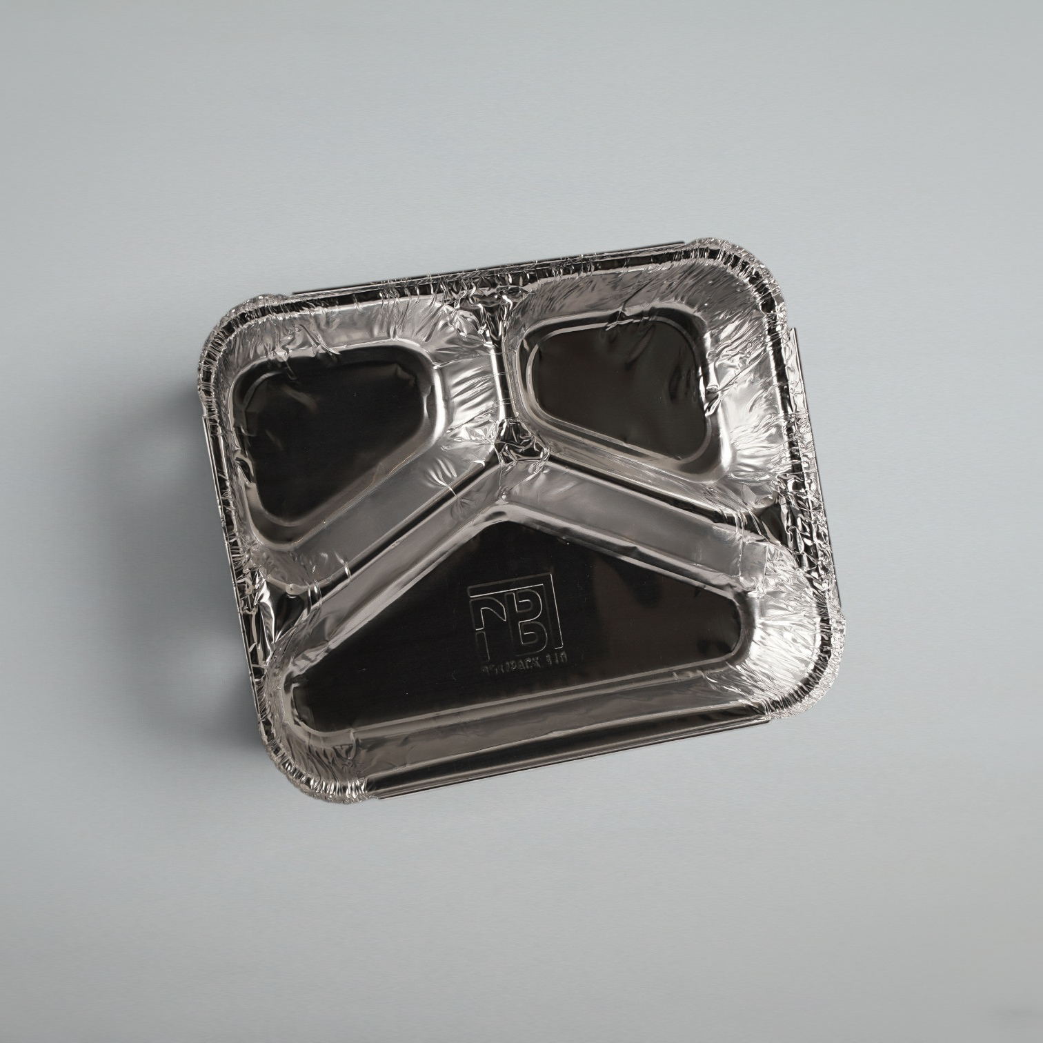 A square aluminum foil compartment tray with three sections, photographed from above on a light gray background. The brand name 'PB' with 'PULBUT LTD.