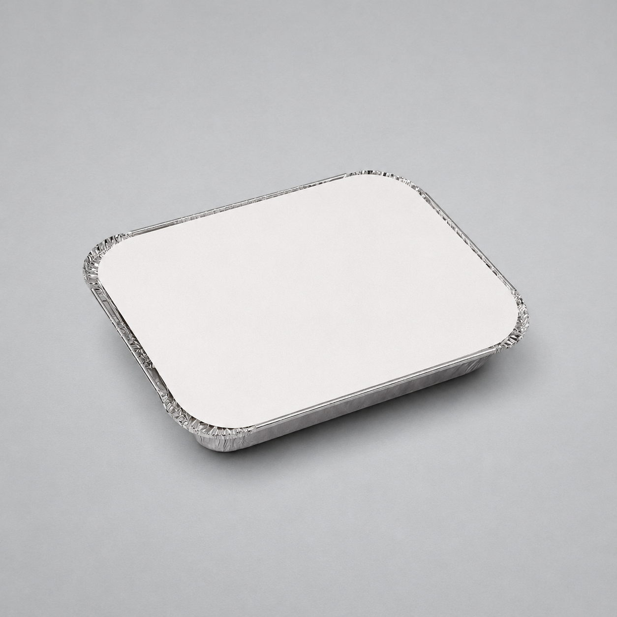 A square aluminum foil tray with a crimped edge, shown from an elevated angle on a neutral gray background.