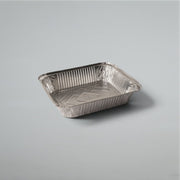 A square aluminum foil tray 455ml with a ribbed fluted edge and a smooth bottom, shown on a neutral light gray background.